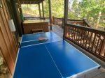 Ping Pong table on the lower level porch next to the hot tub